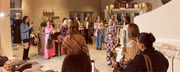 Group of women standing around in a retail store
